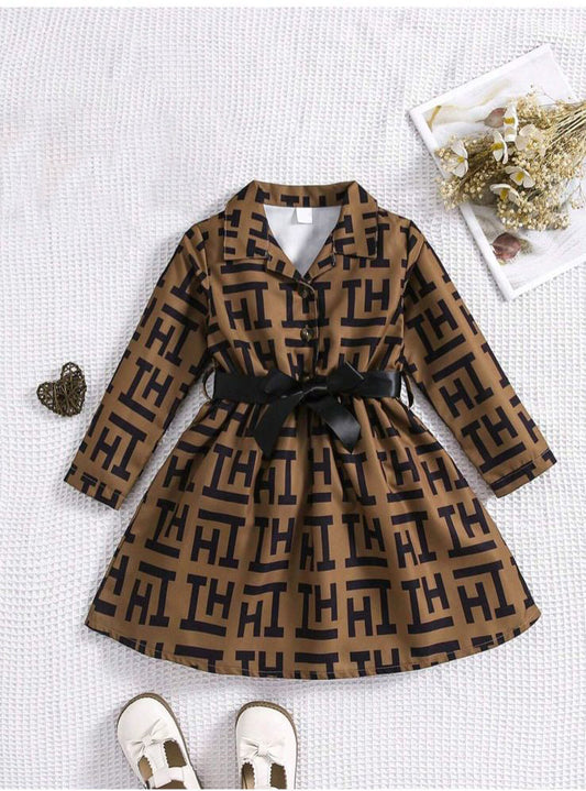 Brown patterned long-sleeve frock dress with V-neck and black bow tie waist